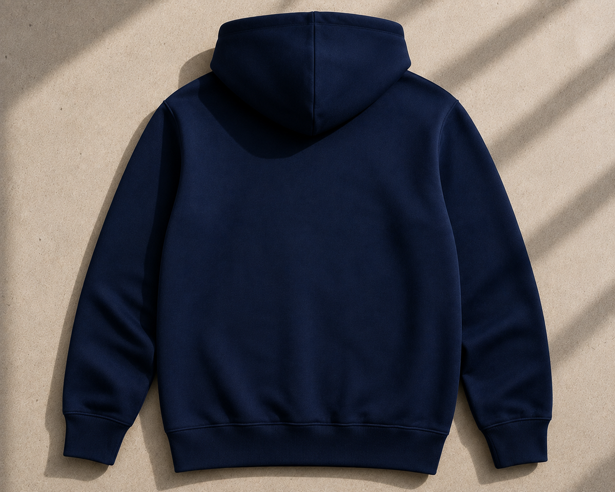 Back view of the Midnight Navy Dynast Heir Signature Pullover Hoodie laid flat in sunlight